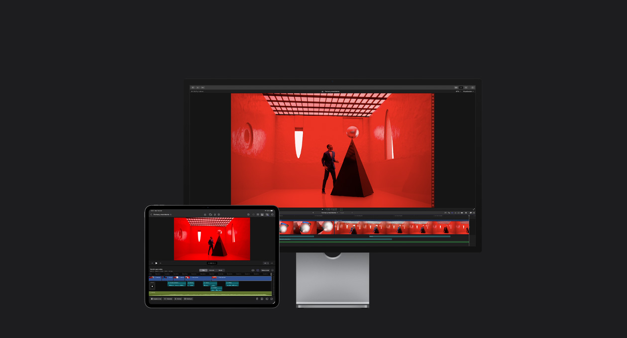 Studio Display para la Mac, iPad Pro de 13 pulgadas, línea de tiempo de Final Cut Pro, imagen de un hombre con un traje azul colocando una esfera color plata sobre una estructura triangular negra en una habitación roja con ventanas de formas abstractas