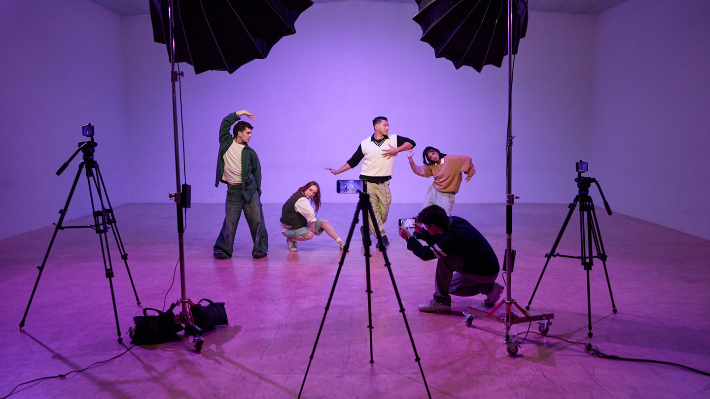 Kyle Hanagami records four dancers in a studio setting using four iPhone 17 Pro Max devices.