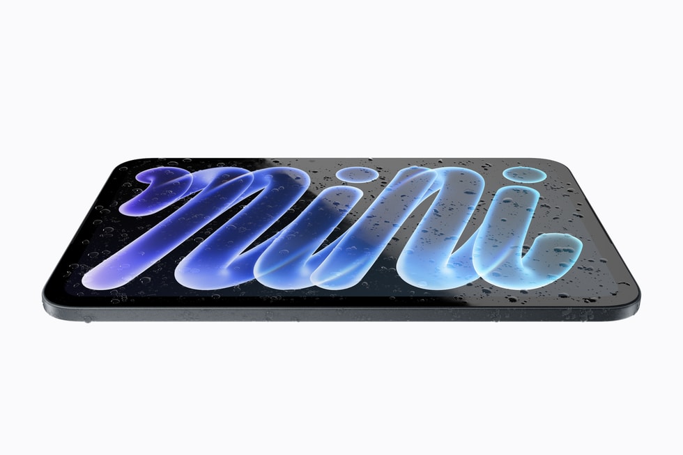 Ein flach liegendes iPad mini mit Wassertropfen darauf.