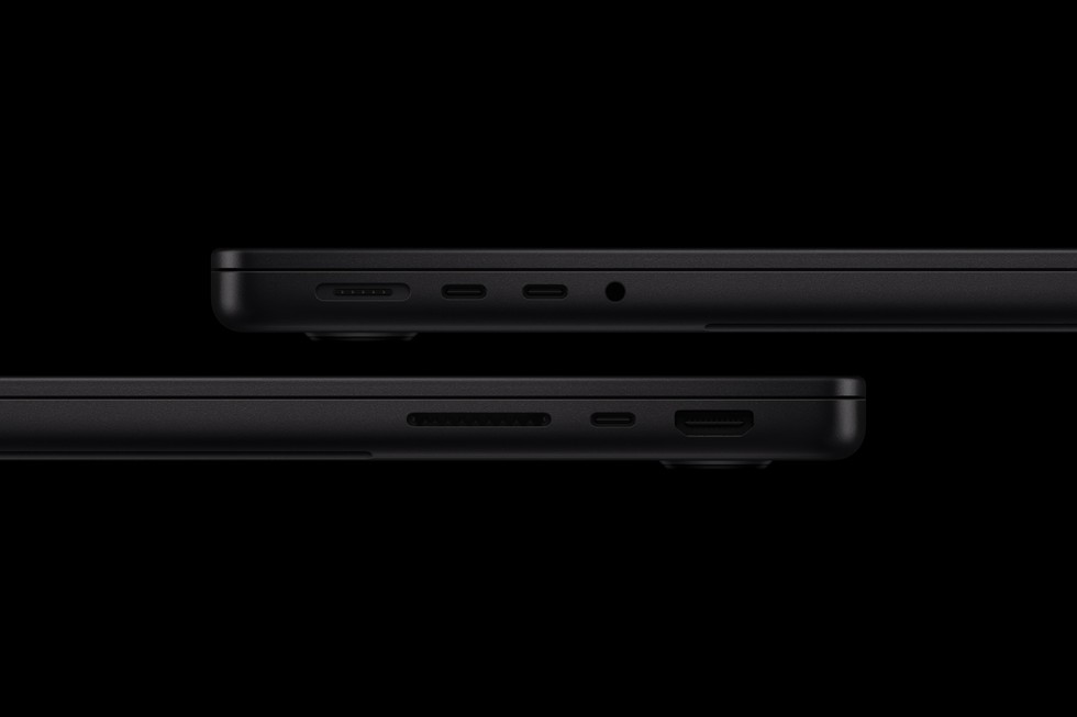Two sides of the new 14-inch MacBook Pro show the laptop’s array of ports.