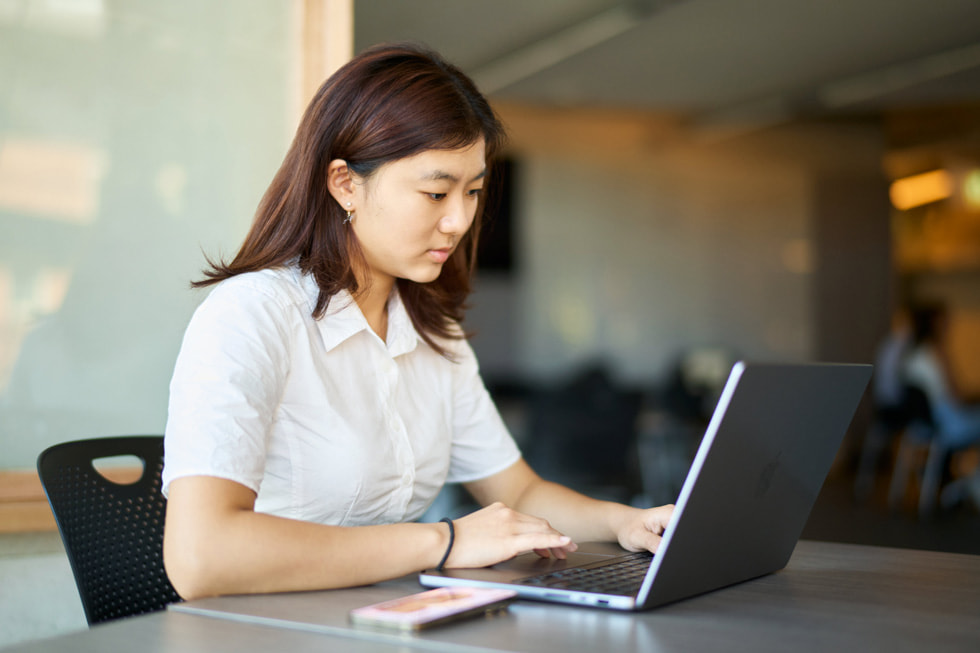 UTS student HyeJun Kim using a MacBook.