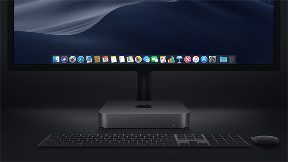 Mac mini fotografiado con un Magic Keyboard, un Magic Mouse y una pantalla.