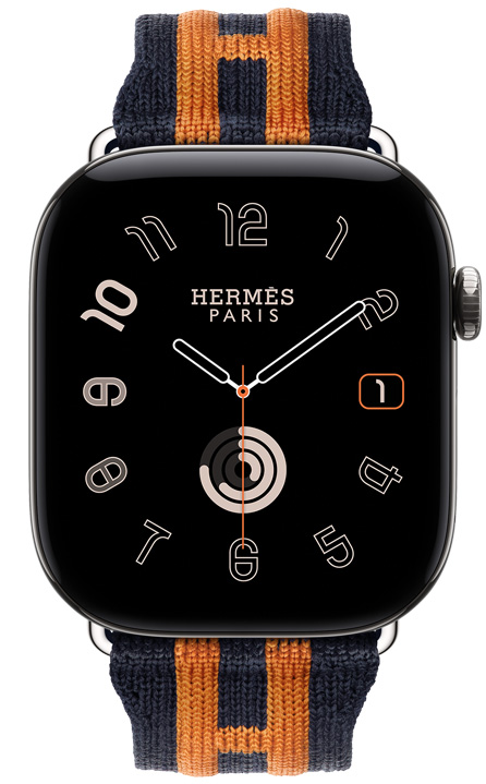 ساعة Apple Watch Hermès Series 12، واجهة الساعة بعقارب Radial، (عقارب الساعة والدقيقة والثانية، الإضافات: التاريخ، حلقات النشاط)، إطار تيتانيوم، لون فضي، الجهة الخارجية اليمنى، التاج الرقمي، زر جانبي نافر، مقترنة بحزام Rocabar Club، لون Bleu Nuit/Orange، نسيج محبوك بلون أزرق داكن مع تصميم بخطوط نافرة بلون برتقالي ترسم حرف H من Hermès