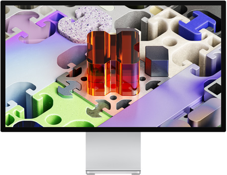 Voorkant van Studio Display XDR met driedimensionale puzzelachtige achtergrond