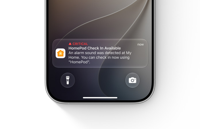 Écran verrouillé d’un iPhone affichant une notification critique de l’app Maison, texte indiquant : Critique, Inspection avec le HomePod disponible, Une alarme a été détectée à Mon Domicile. Vous pouvez procéder dès maintenant à une inspection en utilisant le HomePod