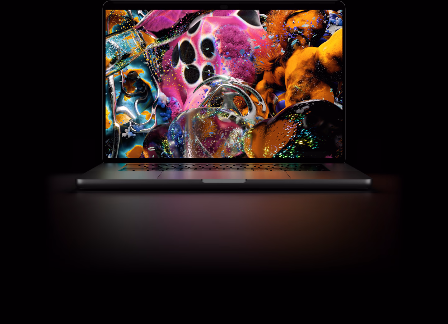 MacBook Pro com Tela PROLED XDR, na cor preto-espacial, mostrando uma imagem detalhada com alto contraste e cores vivas. A tela ilumina o teclado